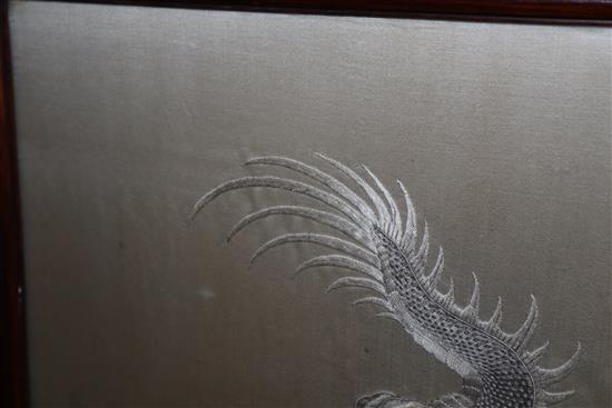 A Chinese couched and embroidered silk dragon firescreen W.69cm